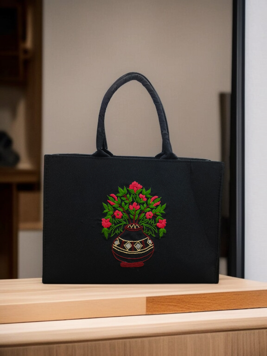 Elegant Handcrafted Black Tote Bag with Vibrant Embroidered Flower Pot Design